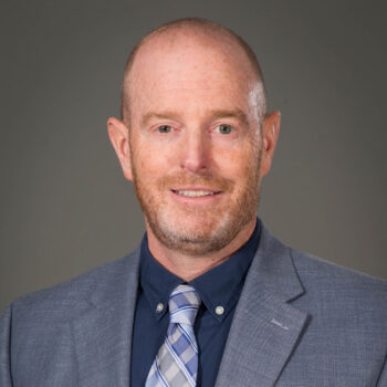 A portrait of Jonathan Cooney.