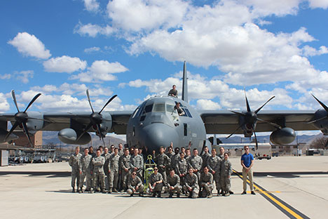 AFROTC Cadets posing in front of a plane.