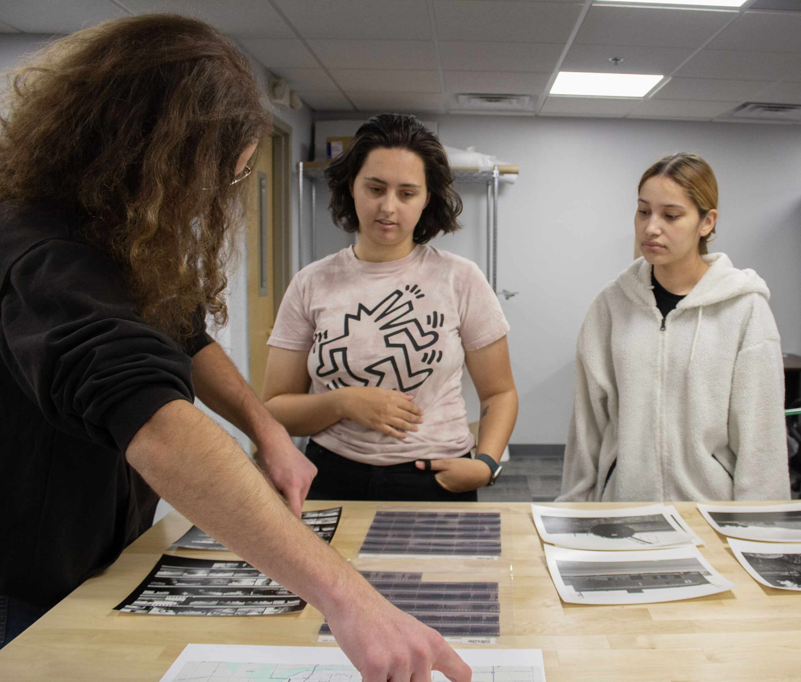 Students reviewing photos in photography class.