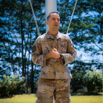 Captain Allen Plack giving a speech outside in air force attire.