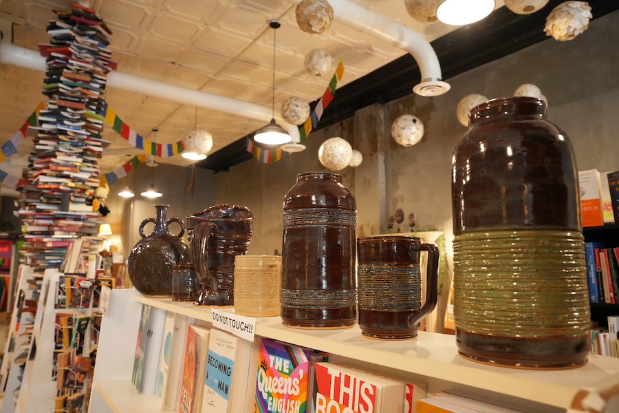 Student's ceramics displayed in Midnight Oil Bookstore.