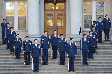 Honor Guard turning guns in the air.