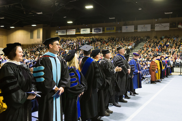 Faculty stand together in their regalia during a UNC commencement ceremony.