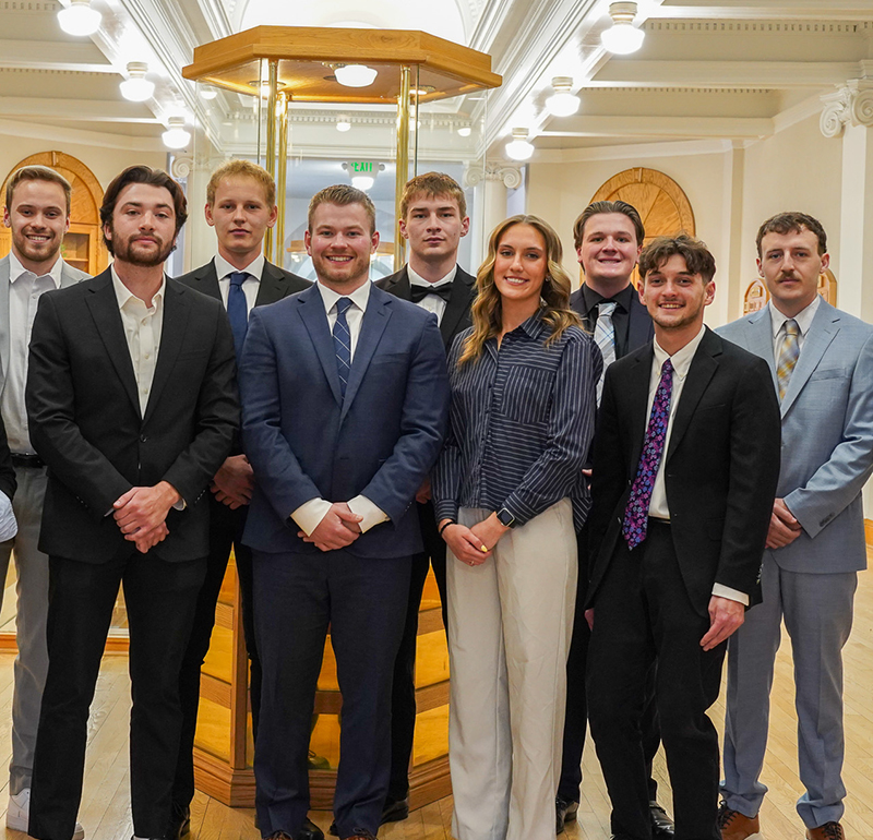 Students part of the Student Foundation Club, dressed in suits and professional attire, showcasing their dedication and professionalism.