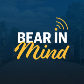 Bear in Mind Podcast written in white and gold, with a blue background