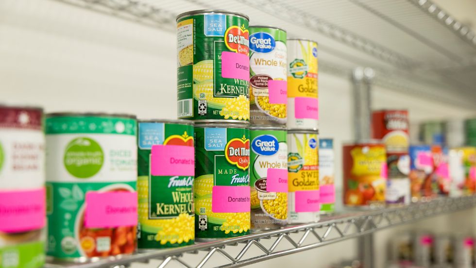 A shelf full of canned goods.