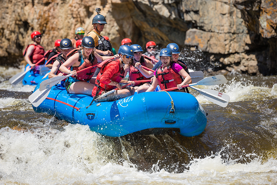 group of students white water rafting