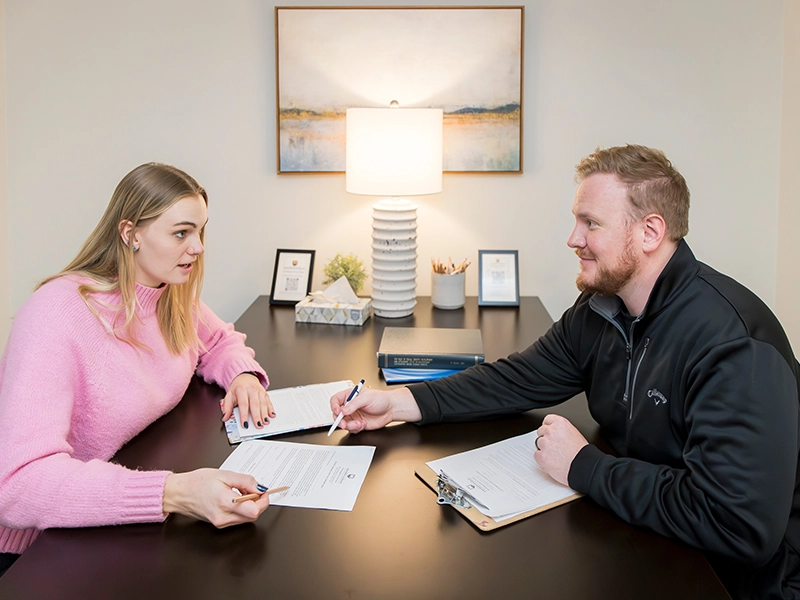 Two counseling professionals working together at UNC’s Psychological Services Clinic.
