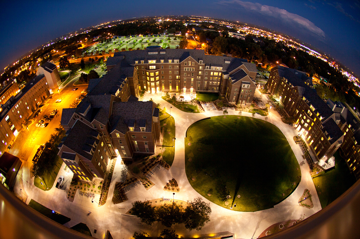 An aerial shot of UNC's campus at night time.