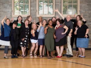 A group of the IRIS grant interpreters are posing for a picture with silly expressions