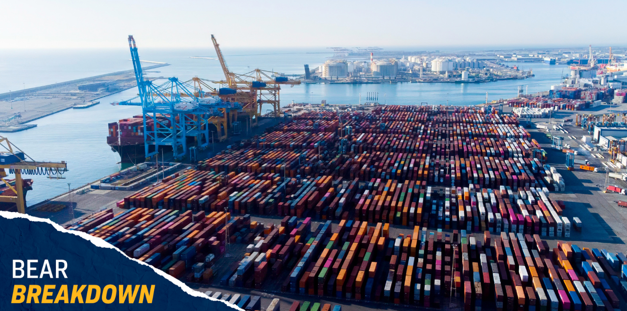 Shipping containers in a lot by the ocean.