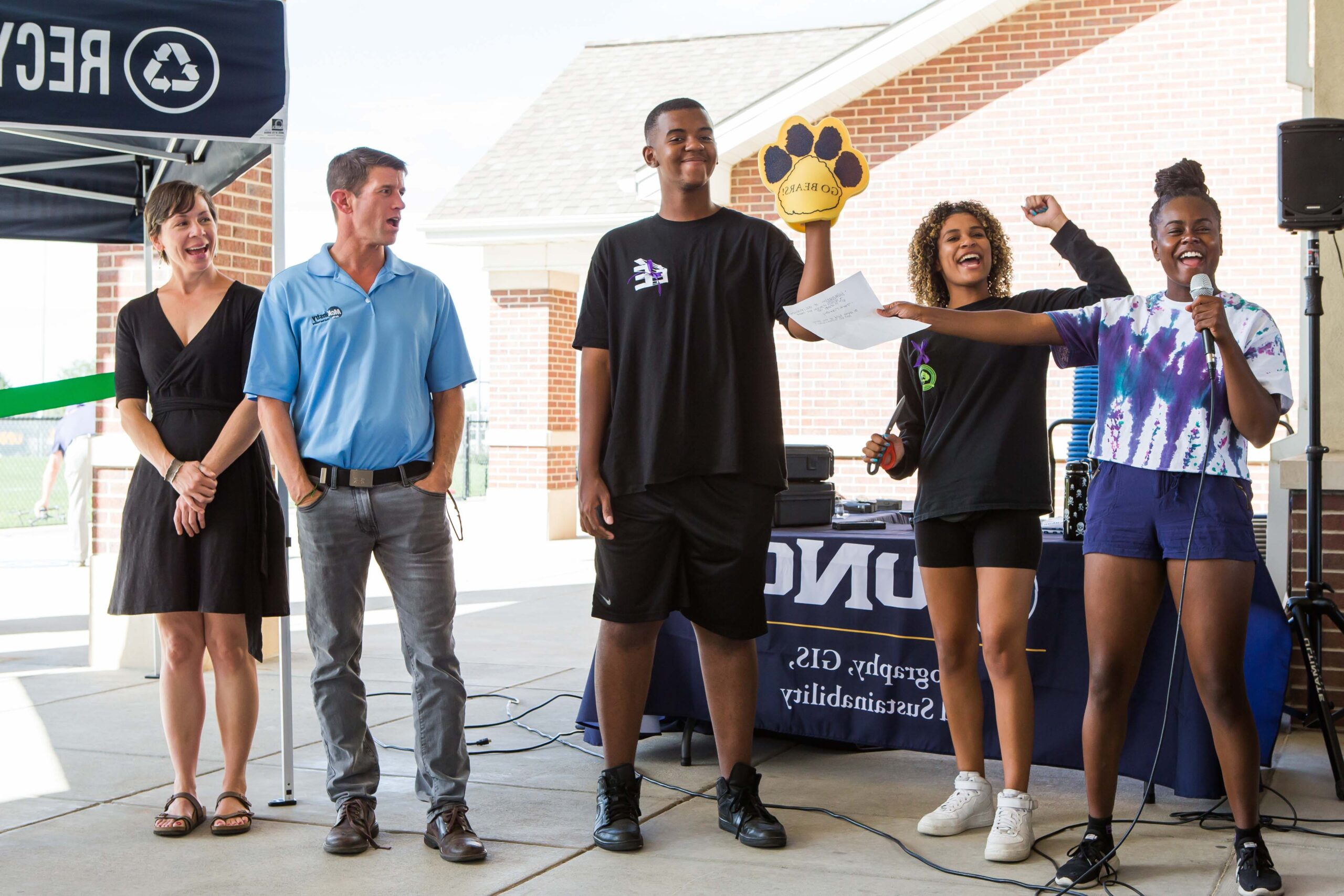 Student attending a recycling and compost event for Student LEAF organization