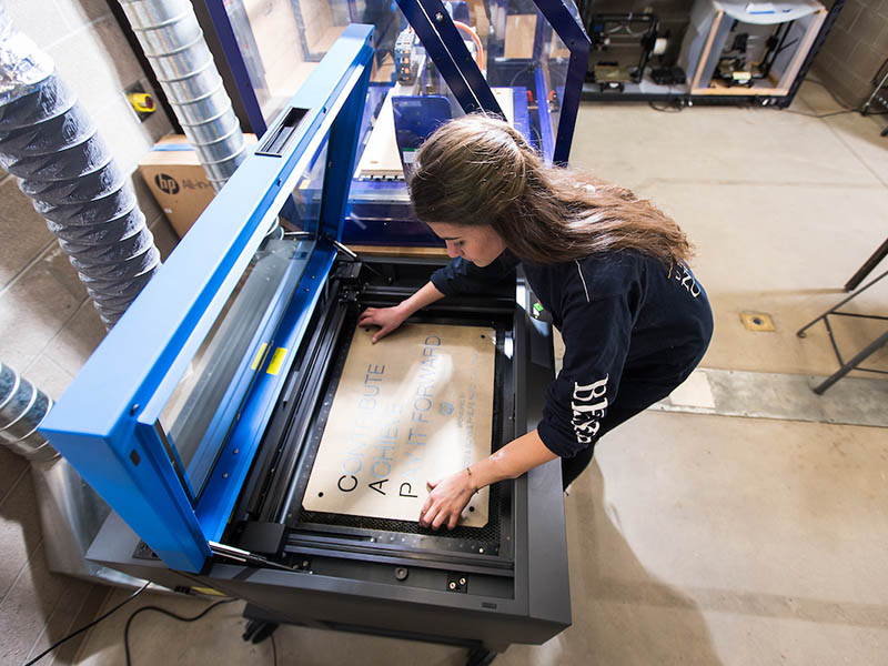 Overhead view of a student working in the 3D Digital Fabrication lab.