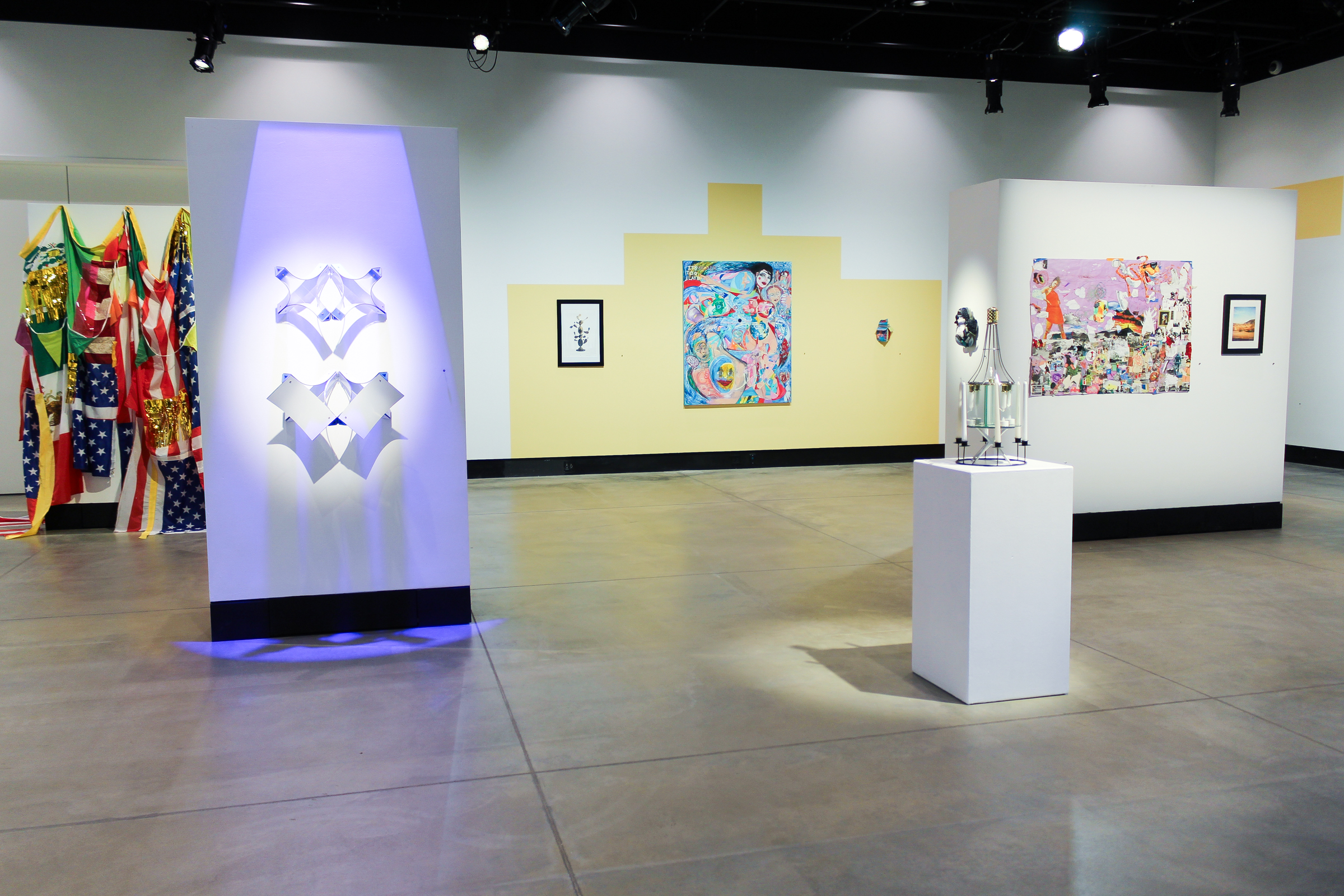 Artwork on view in the Caminos Por Andar exhibition in Campus Commons Gallery.