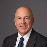 A headshot of Milan Larson