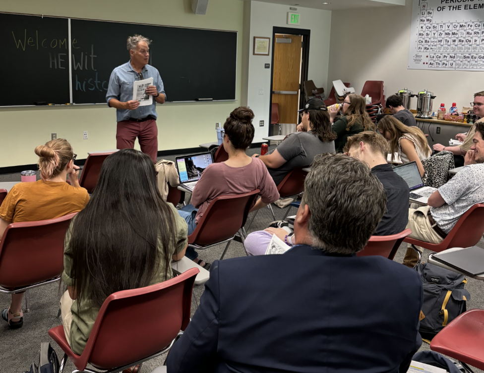 A professor teaching their class