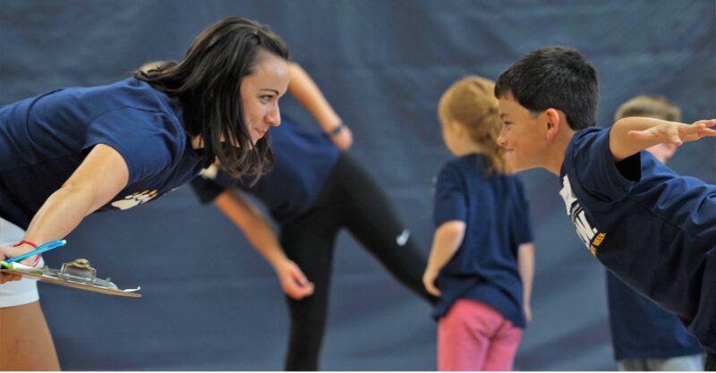 Active Schools team member interacting and with student during game