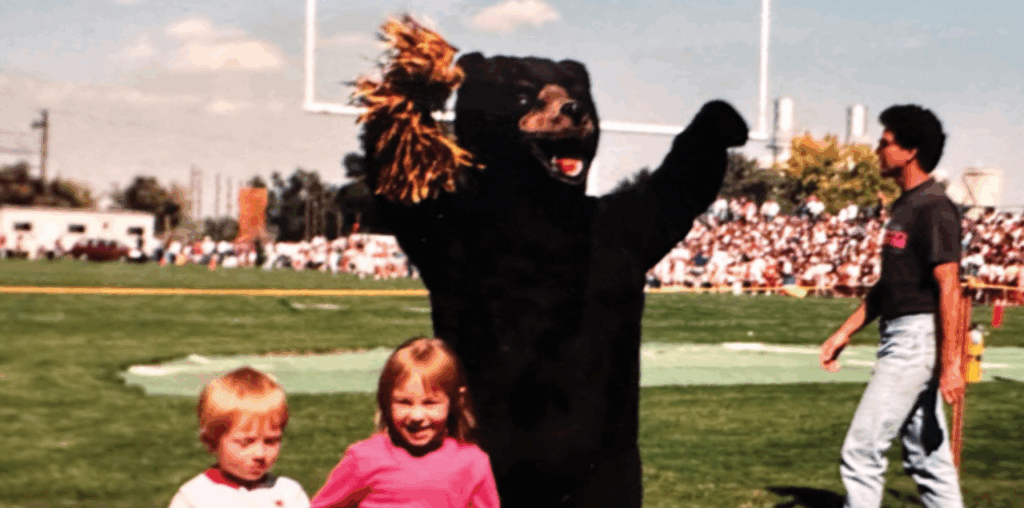 The original UNC mascot, Bentley Bear, cheering at a football game from years past.