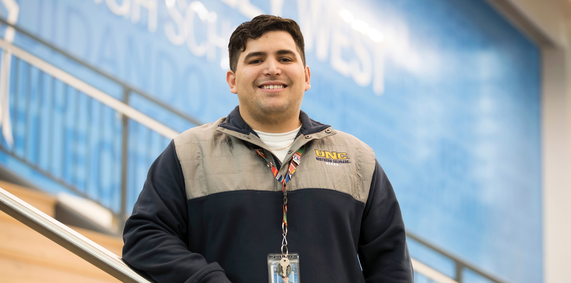 Caleb Flores smiling inside a school