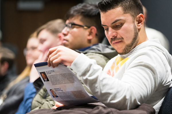 Campus guest reading pamphlet