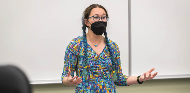 Chelsie Romulo talking to her students in a mask