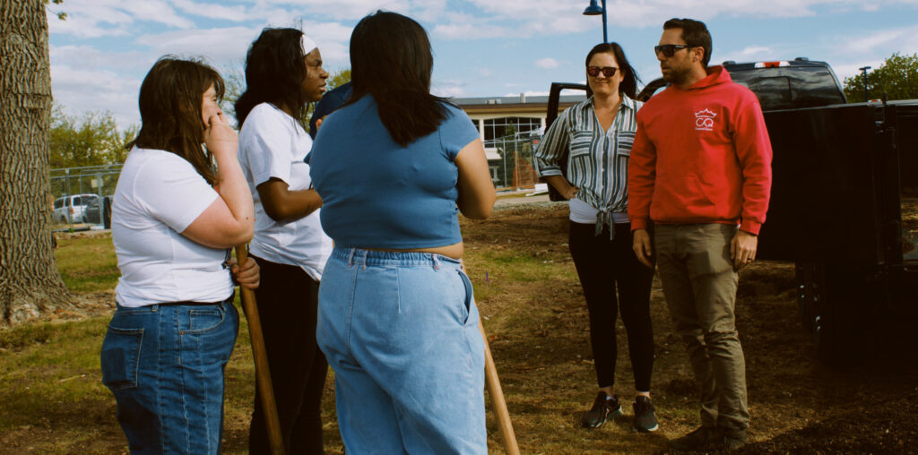 Student LEAF members on site of a composting project