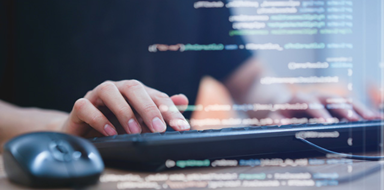 A stock image of someone typing on a computer keyboard.