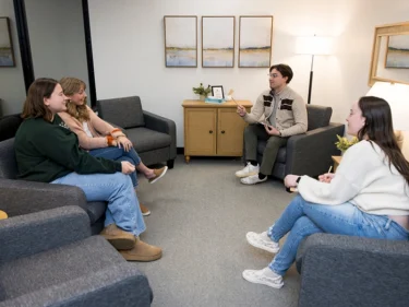 Students participating in a group counseling session at the university counseling center.