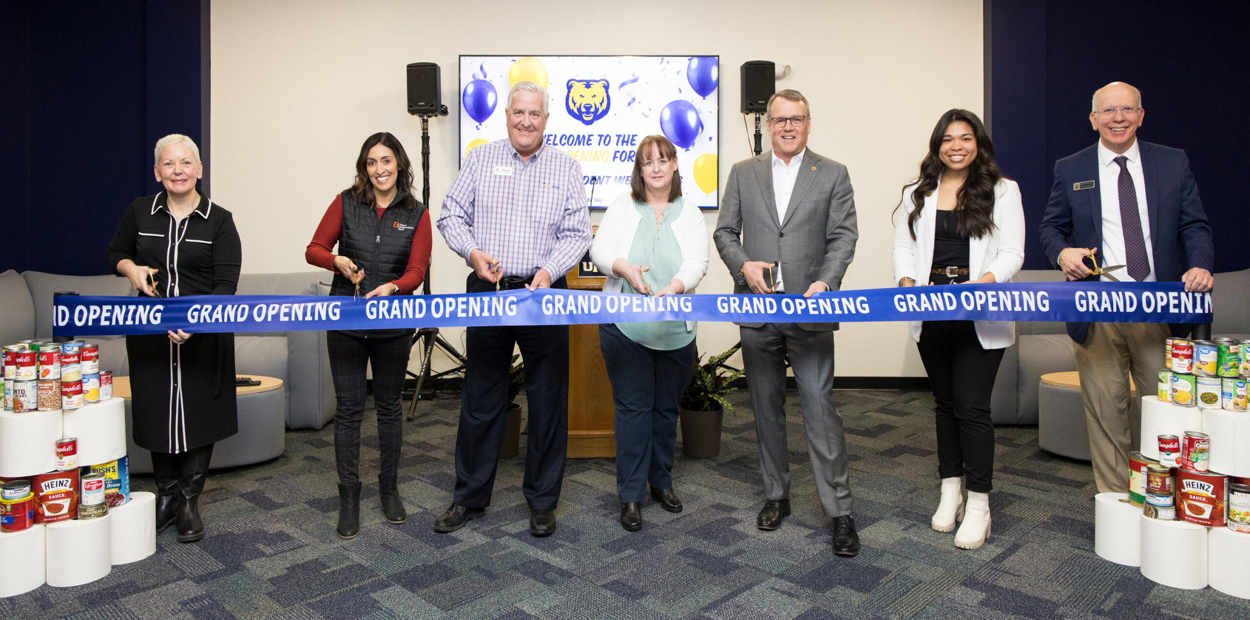 Several UNC stakeholders cut a ribbon to celebrate the grand opening of the Center for Student Well-Being.