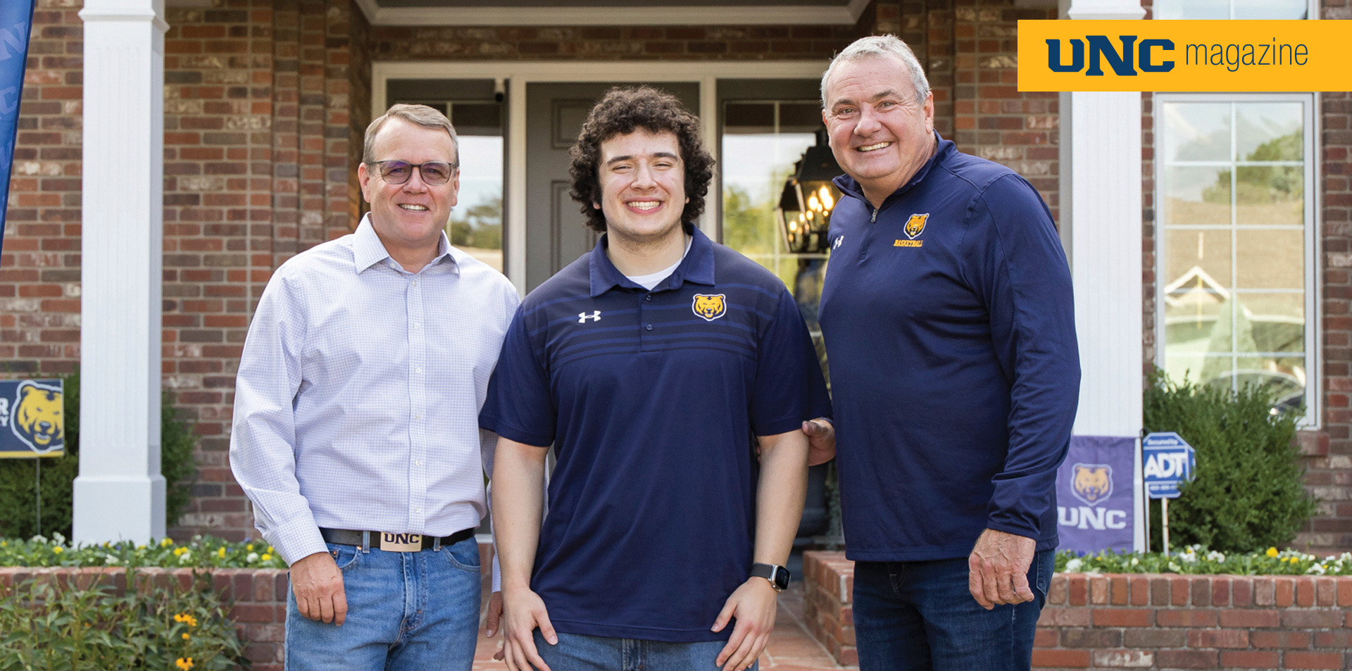 Andy Feinstein, Daniel Garza and John Schmidt standing together for a picture smiling