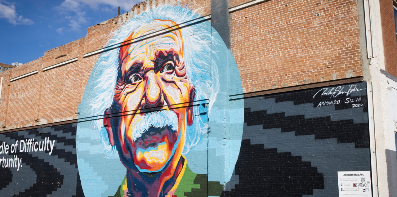 A mural of Albert Einstein painted on the side of a building.