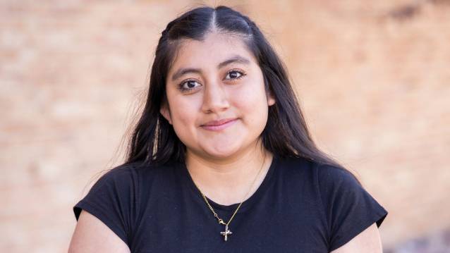 UNC student Elizabeth Hernandez-Caballero smiling at the camera.