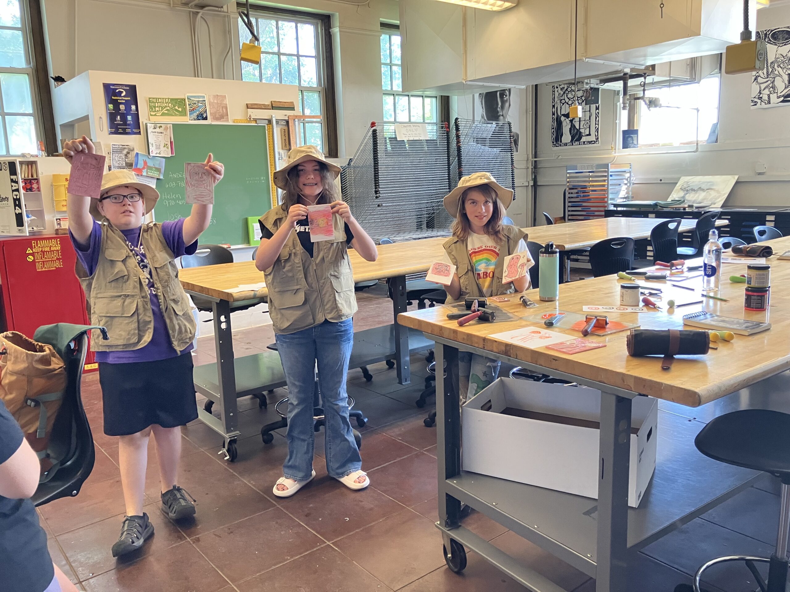 Students showing artwork at Exploring Arts Camp.