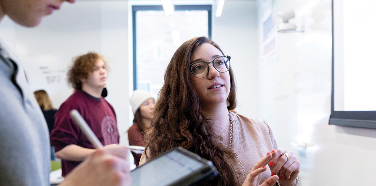 Associate Professor of Chemistry Geneva Laurita teaching a chemistry lab in a classroom.