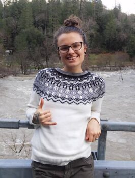 Maddie Gremillion standing on a bridge image