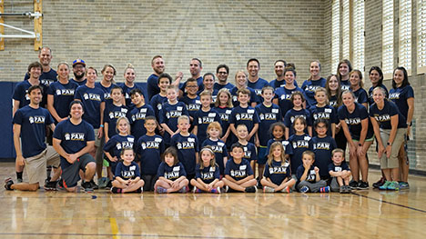Group photo of Bear PAW Summer Camp team with participants