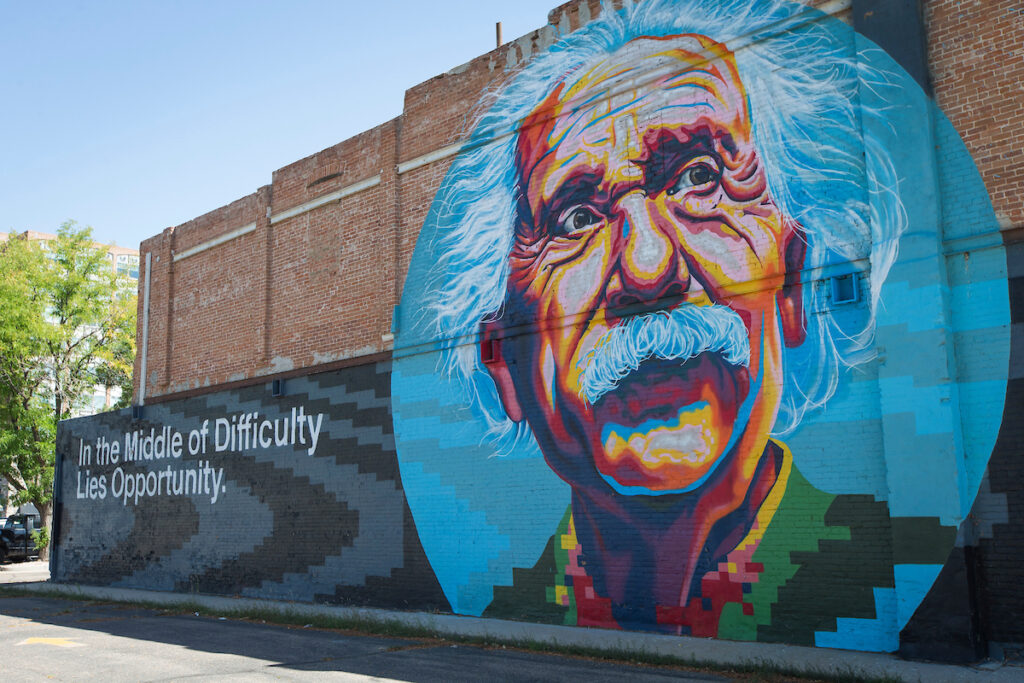 A mural of Albert Einstein on the side of a building