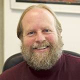 A headshot of Steve Mackessy