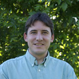 A portrait of Mit McGlaughlin.