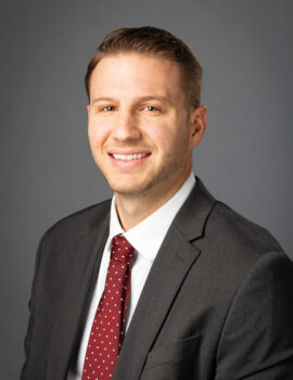 Neal Kingman smiling at the camera.