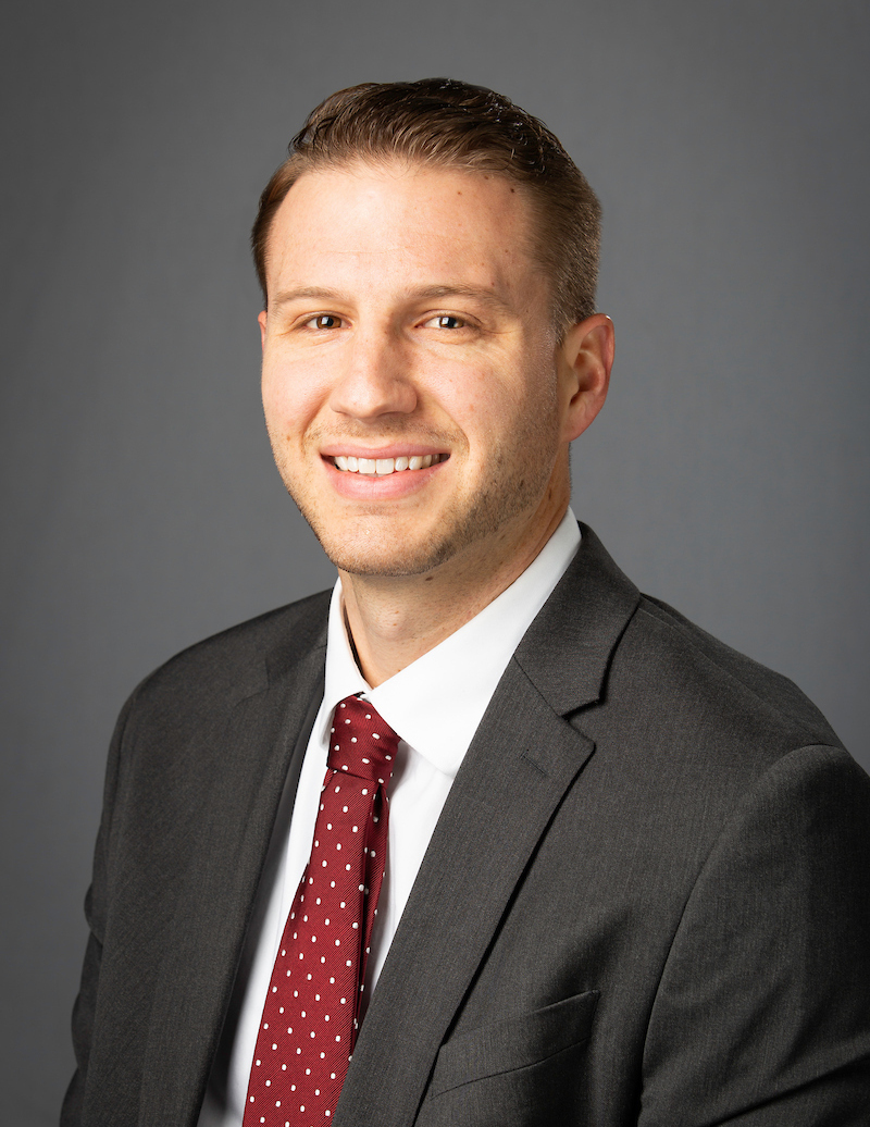 Neal Kingman smiling at the camera.