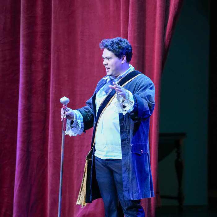 Opera singer on stage during the French Fables and Fairy Tales opera production.