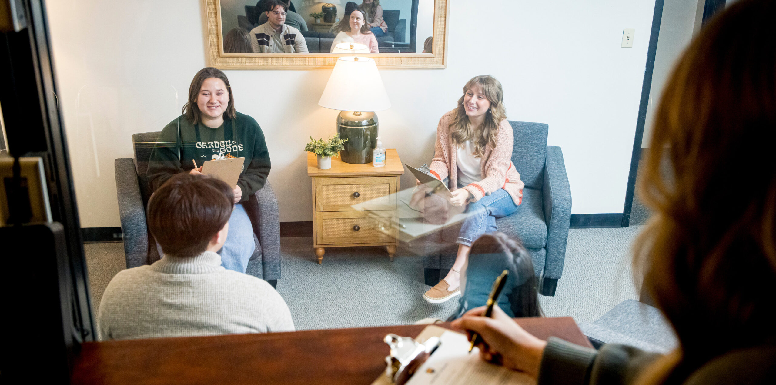Four people talking together in a psychology setting