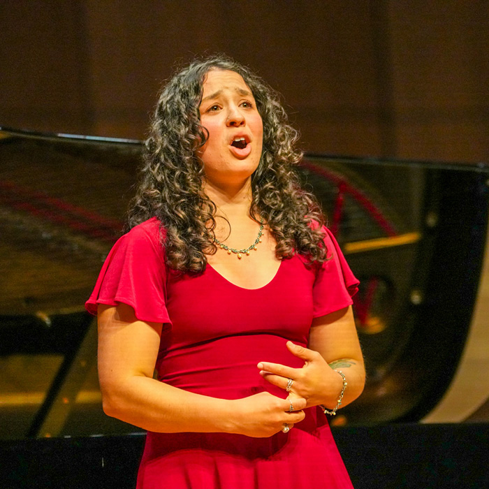 Colleen Martinez singing at the PVA Spotlight event.