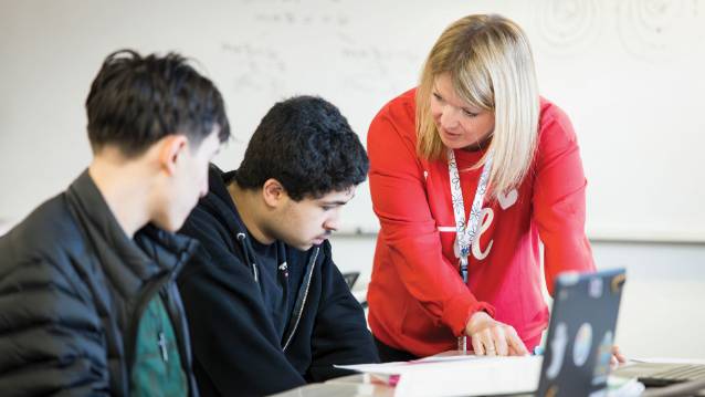 Teacher working with 2 students.