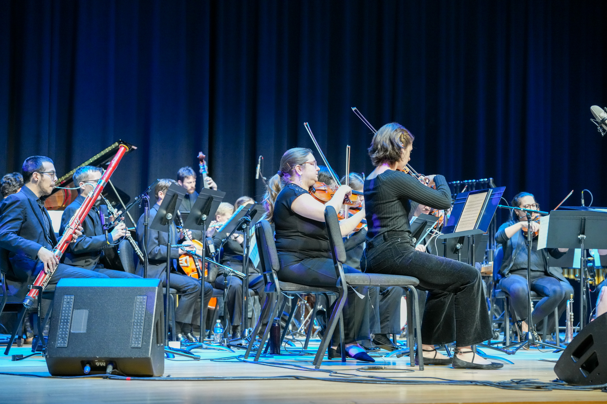Spectrum Studio Orchestra on stage in Campus Commons Performance Hall.