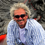 A headshot of Steve Anderson wearing sunglasses