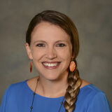 A headshot of Tara Wood