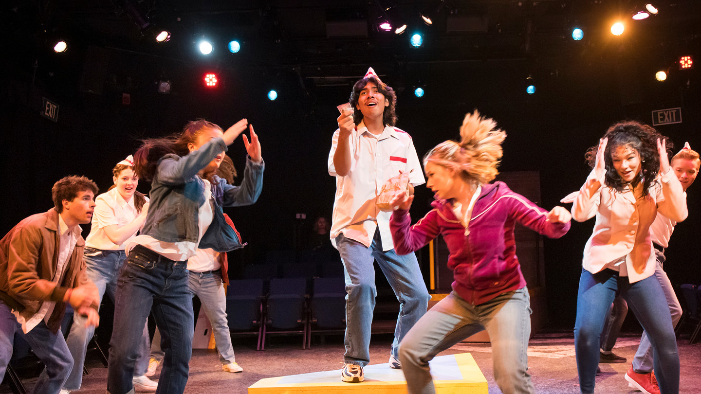 Several students on stage performing Working: A Musical in Norton Theatre.
