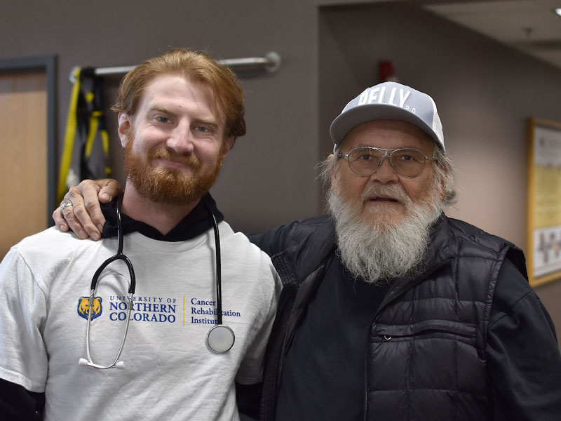 Cancer Rehabilitation Institute patient with their arm around staff member.